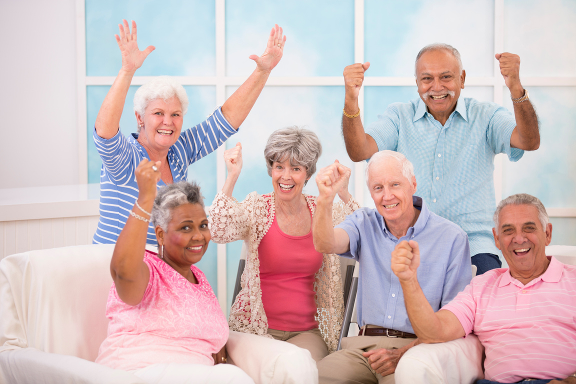 Diverse group, happy senior adult friends. Home or assisted living.