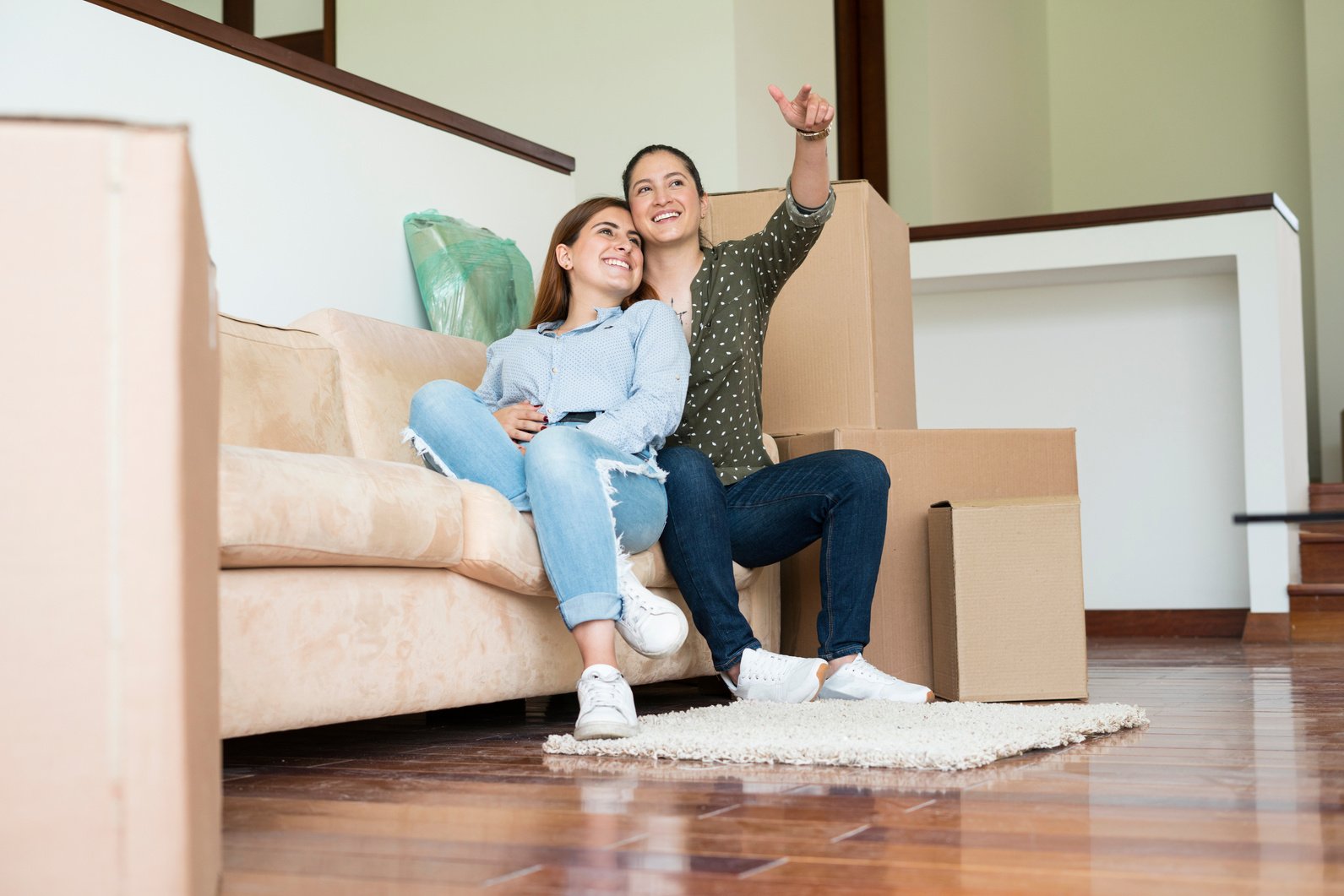 LGBT couple of women moving to their new home